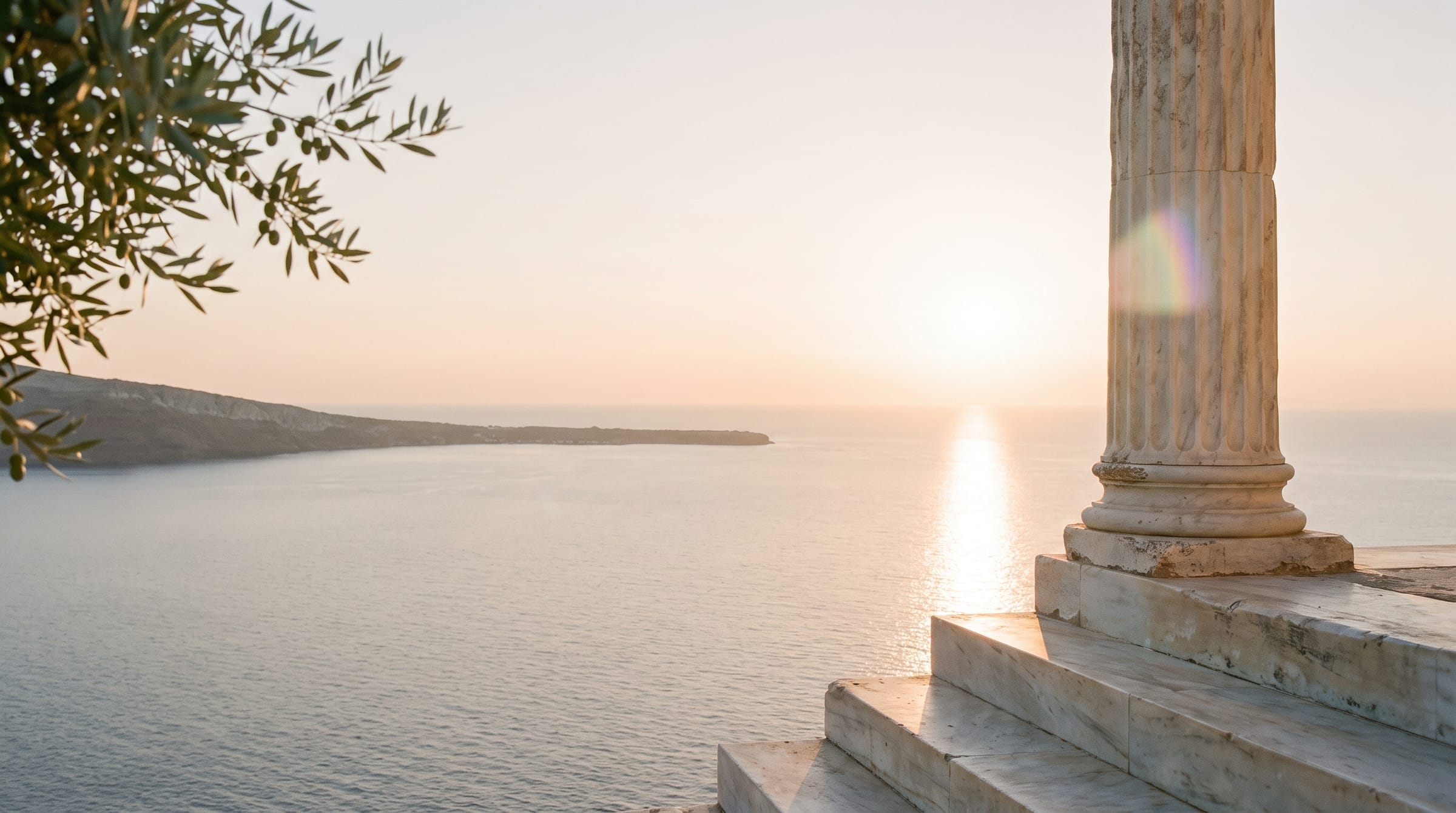 A white marble column and steps above the sea at golden hour, the sun low on the water, an olive branch in the light
