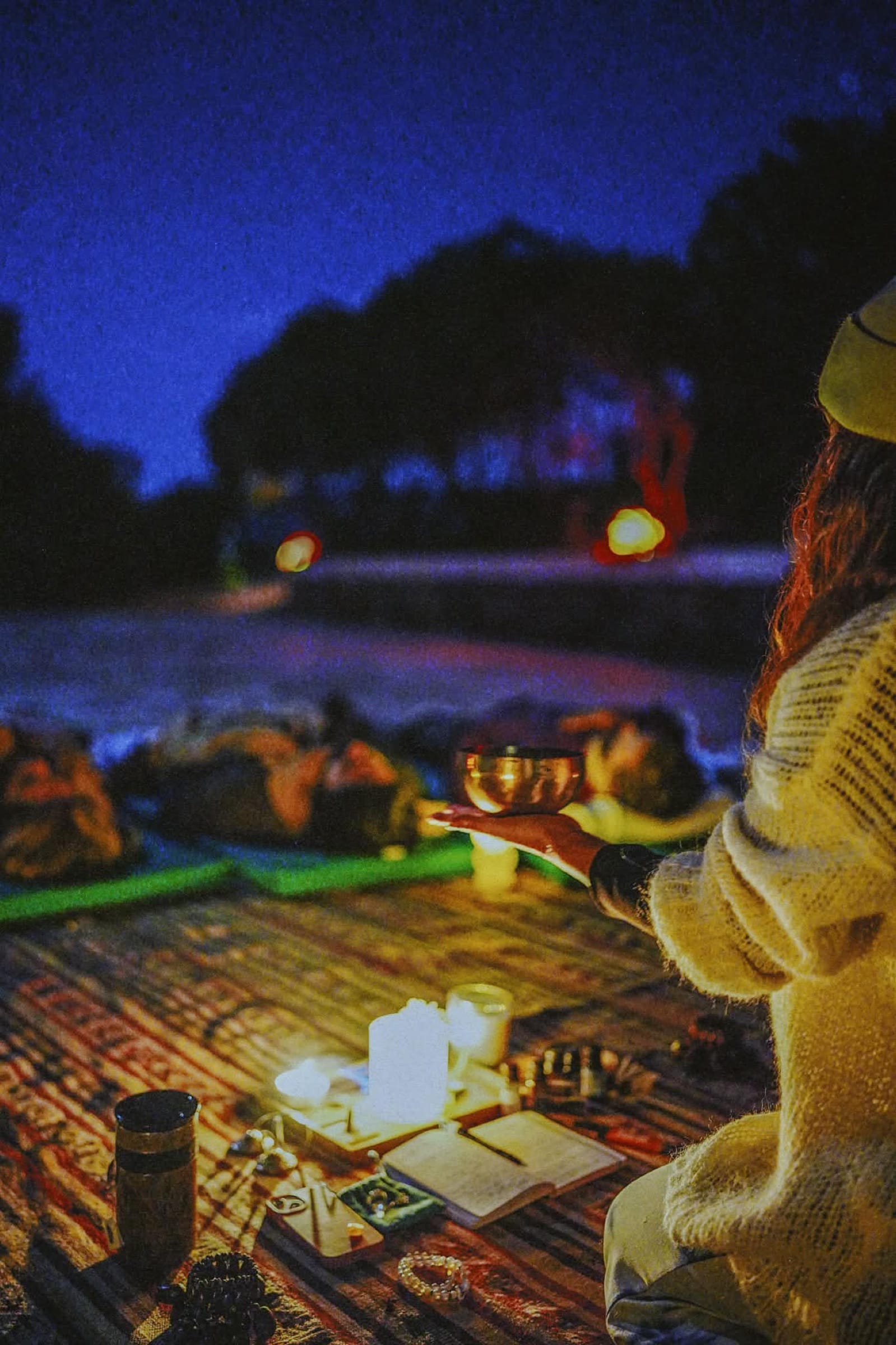Sound bowls and candlelight at a night ceremony